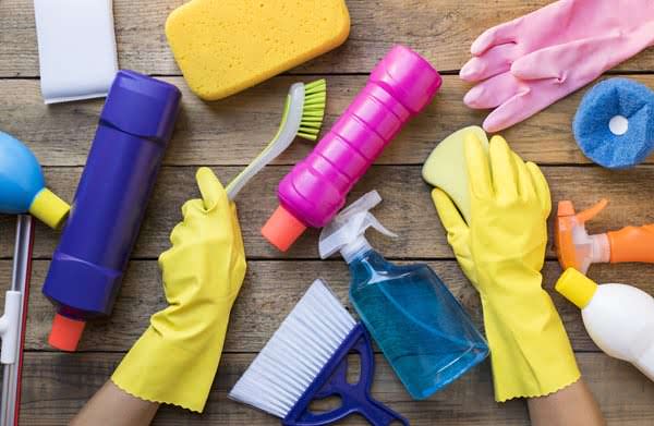 Woman-cleaning-products-table.jpg