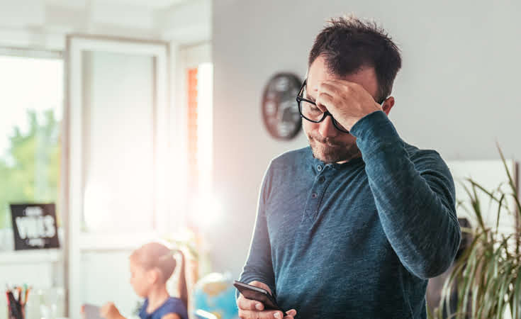 Stressed-man-looking-at-phone-jpg735x450.jpg