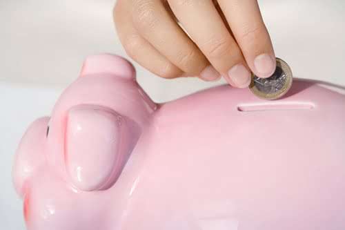 Close-up-coin-in-piggy-bank.jpg